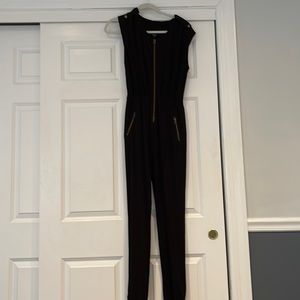Guess black jumpsuit with epilets. Zippers opening and zipper pockets. So comfy